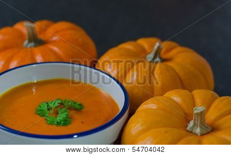 Pumnkin Soup And Row Of Pumkins