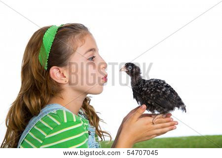 breeder hens kid girl rancher farmer kissing a chicken chick white background