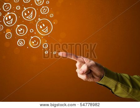 Group of happy hand drawed smiley faces coming out of gun shaped hands