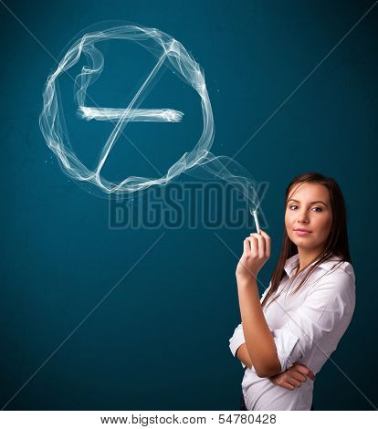 Pretty young lady smoking unheathy cigarette with no smoking sign