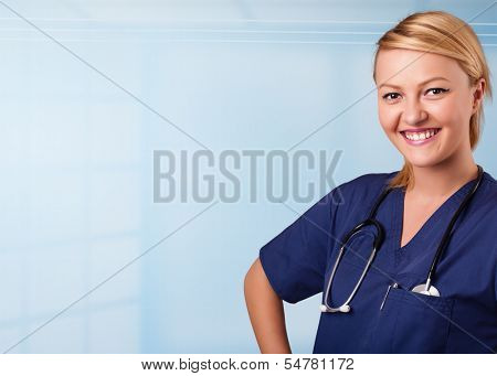 Pretty young nurse in hospital listening to empty copy space with sthetoscope
