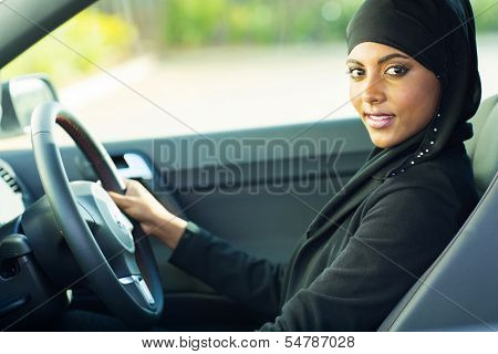 beautiful modern muslim woman in a car
