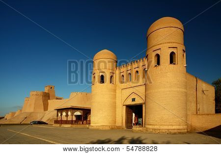 Western gate (Ata Darvoza) to ancient town of Itchan Kala at sunset. The city of Khiva, Uzbekistan