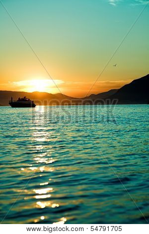 Sunset on adriatic sea with boat