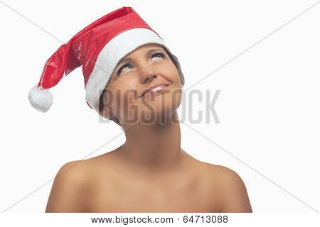 Happy Woman In Santa Hat Looking Up