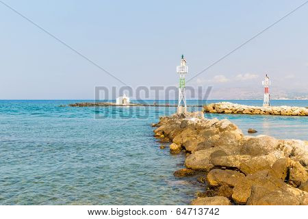 Old Venetian Lighthouse At Harbor In Crete, Greece. Small Cretan Village Kavros. Travel Background