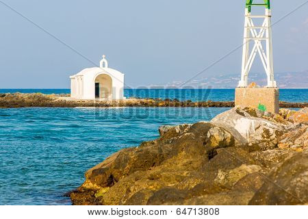 Old Venetian Lighthouse At Harbor In Crete, Greece. Small Cretan Village Kavros. Travel Background