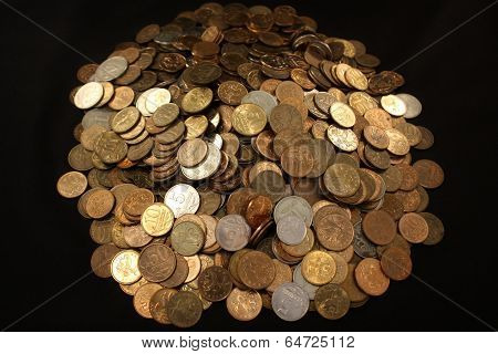 Placer coins on a black background