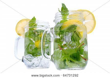 Refreshing Mint And Lemon Drink In Glass Jars