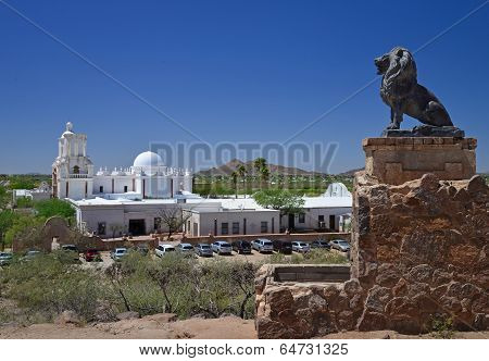 A carved stone lion keeps watch over the Mission in Tucson Arizona.