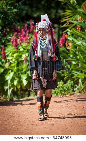 MAE HONG SON, CHIANG MAI, THAILAND - DEC 4, 2013: Unidentified Akha indigenous hill tribe woman in traditional clothes. Asian ethnic tribal group. Popular tourist travel destination in north Thailand