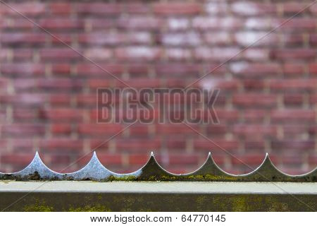 razor fence with brick background