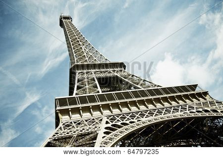 View of the Eiffel Tower with blue sky and white clouds, Paris, France