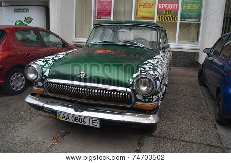 KIEV, UKRAINE - OCTOBER 19: exterior of the vintage Soviet car GAZ-21 Volga with folk stile tuning on October 19, 2014 in Kiev,Ukraine