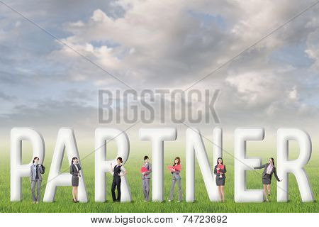 Concept of partner, friends,collaborate with group of business people stand with 3d text. 