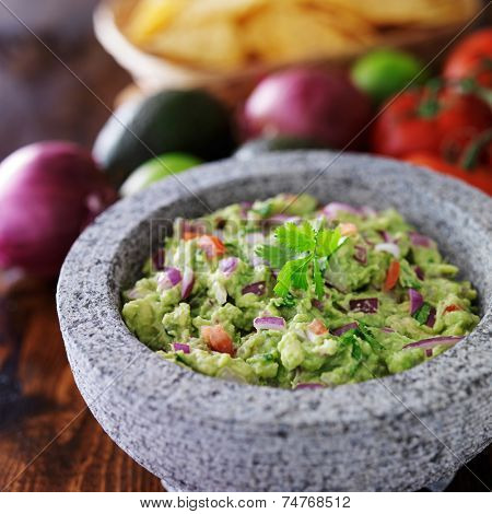 mexican guacamole in stone molcajete