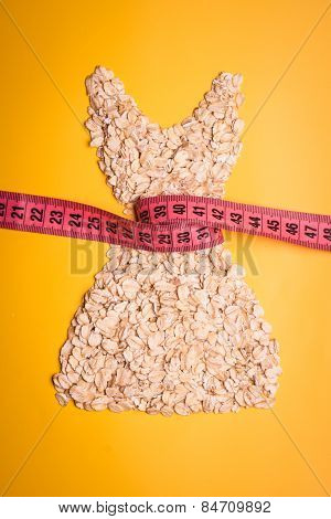 Dress Shape Made From Oatmeal With Measuring Tape