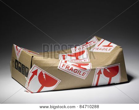 brown box with fragile sticker damaged