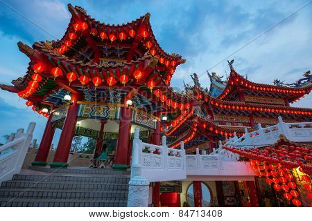 KUALA LUMPUR, MALAYSIA - FEBRUARY 23, 2015: Tourists visit the scenic Thean Hou Temple at night with hundreds of lanterns hung across the courtyard celebrating the lunar Chinese New Year.