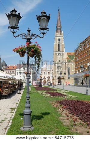 NOVI SAD, SERBIA - AUGUST 03: old style street light and the Catholic Cathedral in main square of Novi Sad. Shot in 2014 