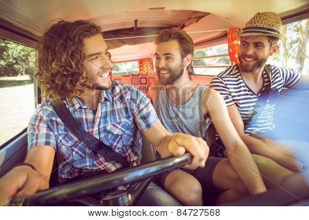 Hipster friends on road trip on a summers day