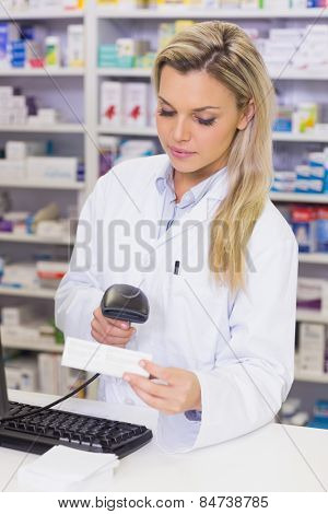 Pharmacist scanning medicines at the hospital pharmacy
