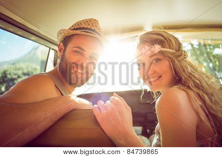 Hipster couple on road trip on a summers day