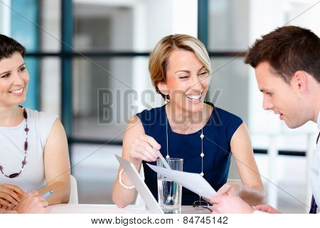 Businesswoman doing a presentaion in front of her collegues