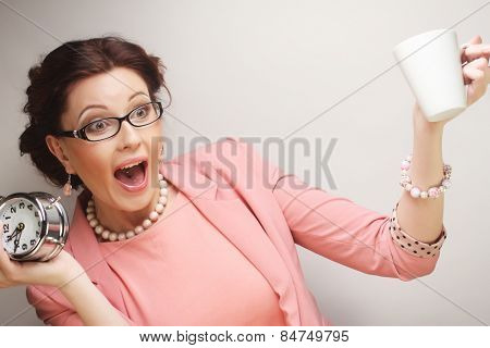 Young funny businesswoman having a coffee-break