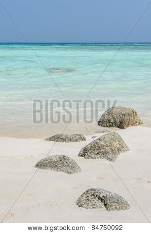 White Sand Beach With Rock