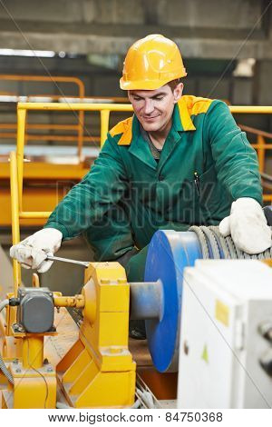 industrial worker with spanner at factory construction workshop