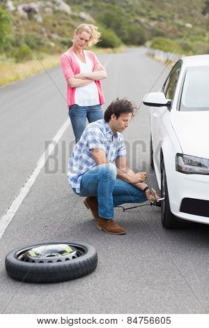 Couple after a car breakdown at the side of the road