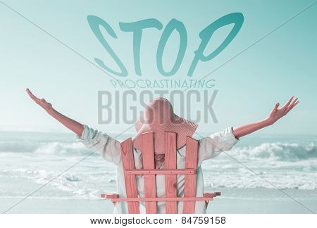 Woman relaxing in deck chair by the sea against stop procastinating