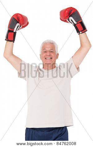 Senior man in boxing gloves on white background