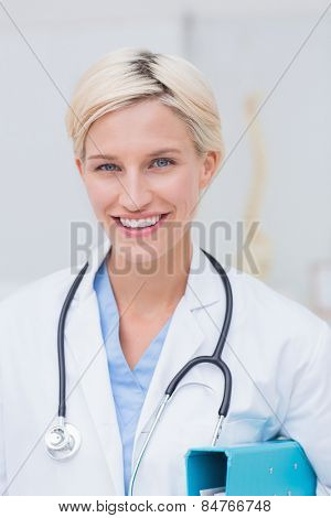 Portrait of confident female doctor smiling in clinc