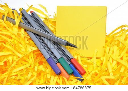 Markers with yellow sticky notes