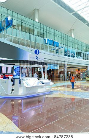 DUBAI, UAE - APRIL 18, 2014: airport interior. Dubai International Airport is an international airport serving Dubai. It is a major airline hub in the Middle East, and is the main airport of Dubai.
