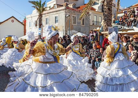 Sesimbra, Portugal. February 17, 2015: The Baianas, one of the most historically important characters of the Rio de Janeiro Brazilian style Carnaval Parade, dancing Samba. Represented by older women.
