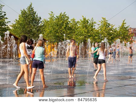 Young People Bathing In Dry Fountain