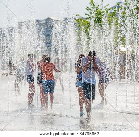 Young People Bathing In Dry Fountain