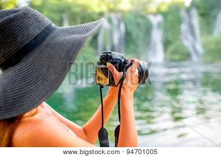 Woman tourist near Kravica waterfall