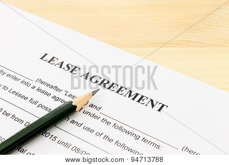 Lease Agreement Contract Document And Pencil Bottom Left Corner