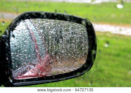 Closeup Of Car Window And Mirror With Rain Drop
