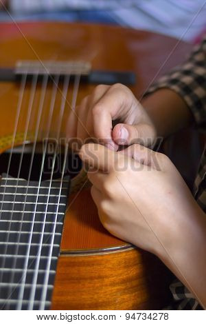 Acoustic Guitar And Girl's's Hands