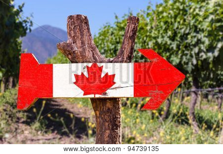 Canada Flag wooden sign with winery background
