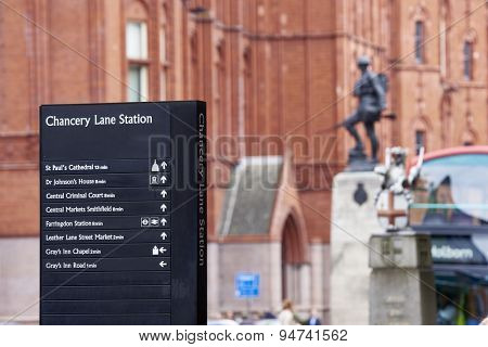 LONDON, UK - JUNE 23: Chancery Lane Station direction sign with war memorial in the background. June 23, 2015 in London.