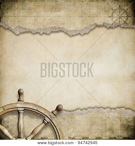 old steering wheel and torn nautical map background