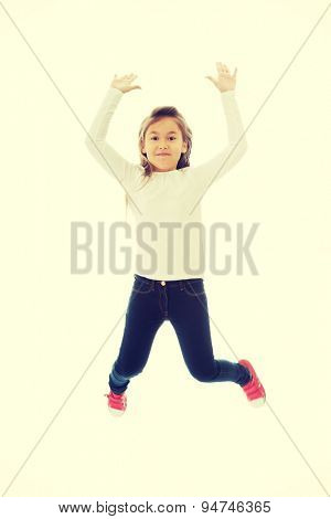 Little pretty girl jumping with joy