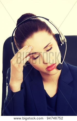 Portrait of anoyed support phone operator in headset