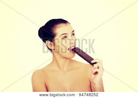Beautiful woman eating a waffer